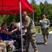 Soldier Passes Roses to Family