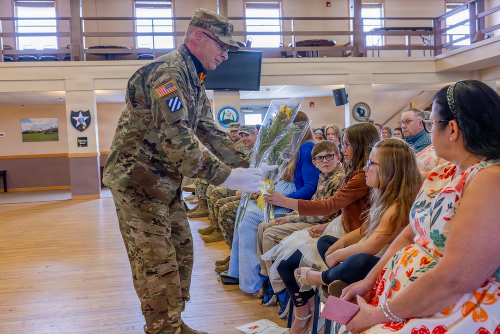 Soldier Hands Yellow Roses to Family