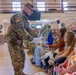 Soldier Hands Yellow Roses to Family