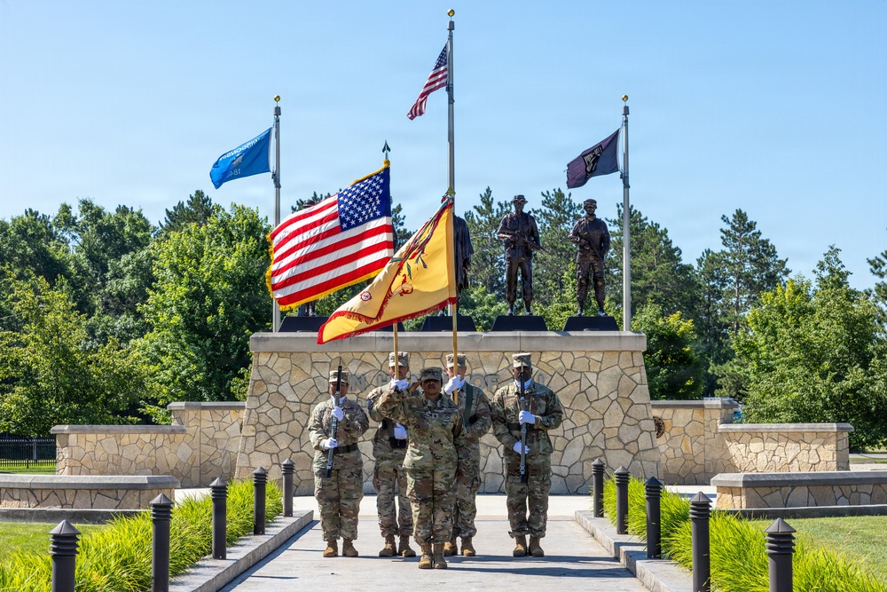 Soldiers Salute Flag during National Anthem