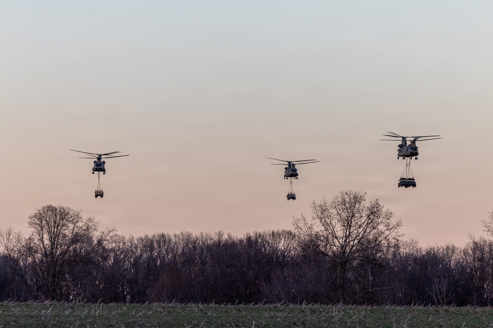Chinooks Airlift Vehicles during Air Assault