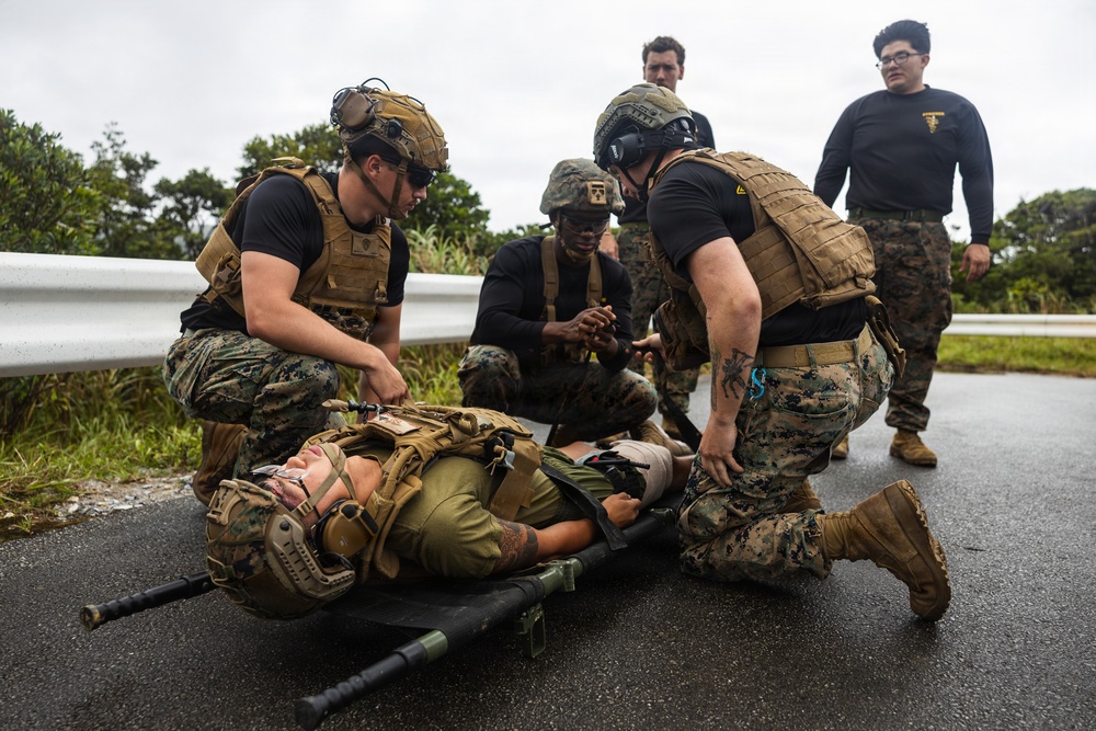 U.S. Marines and Sailors with III Medical Battalion Conduct a Simulated Casualty Evacuation