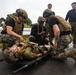 U.S. Marines and Sailors with III Medical Battalion Conduct a Simulated Casualty Evacuation