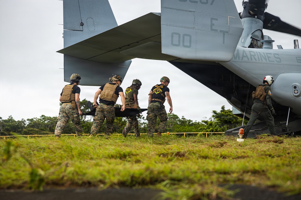 U.S. Marines and Sailors with III Medical Battalion Conduct a Simulated Casualty Evacuation