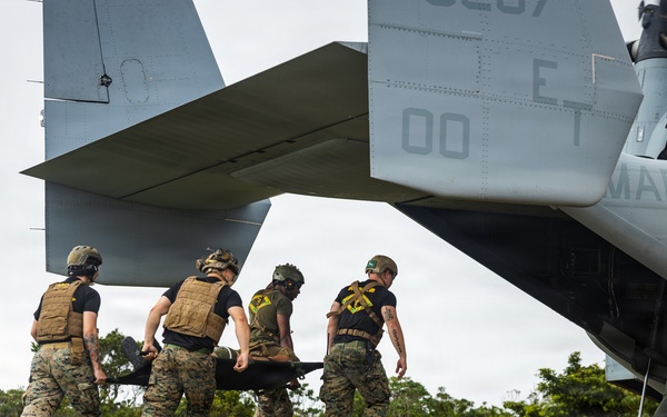 U.S. Marines and Sailors with III Medical Battalion Conduct a Simulated Casualty Evacuation