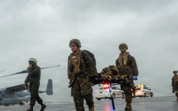 U.S. Marines and Sailors with III Medical Battalion Conduct a Simulated Casualty Evacuation