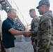 Service Members and Civilians Assigned to the 10th Support Group Receive Challenge Coins