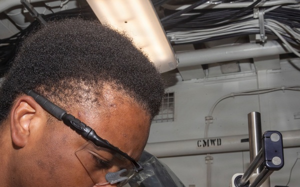 George Washington Sailor Maintains a Telecommunications System
