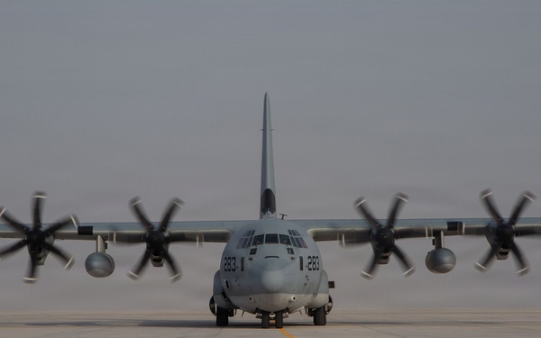Marines onload equipment onto a KC-130J Super Hercules