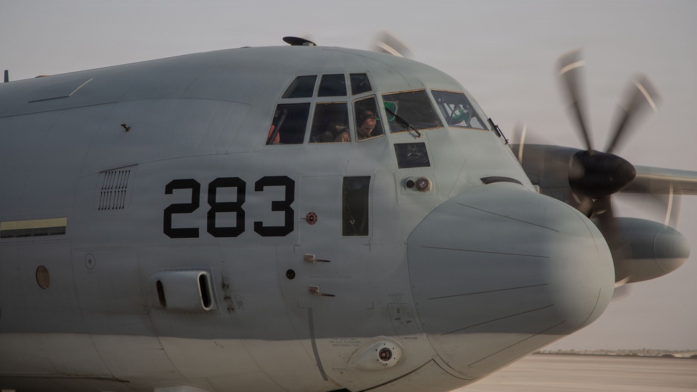 Marines onload equipment onto a KC-130J Super Hercules