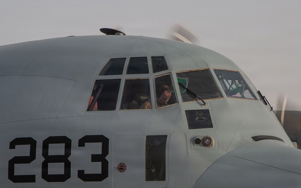 Marines onload equipment onto a KC-130J Super Hercules