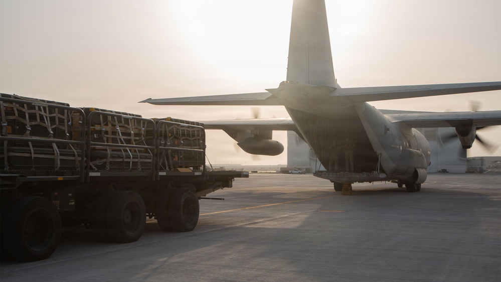 Marines onload equipment onto a KC-130J Super Hercules