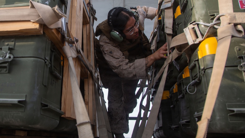 Marines onload equipment onto a KC-130J Super Hercules