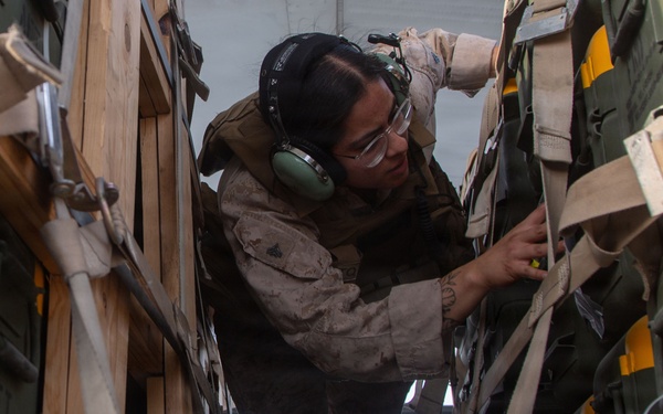 Marines onload equipment onto a KC-130J Super Hercules
