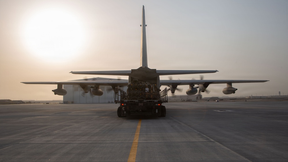 Marines onload equipment onto a KC-130J Super Hercules