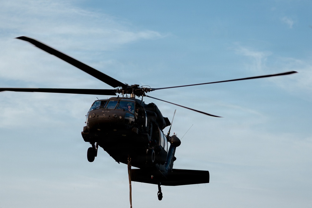 Illinois Army National Guard Black Hawk Crew Conducts Sling Load Resupply at Camp Grayling