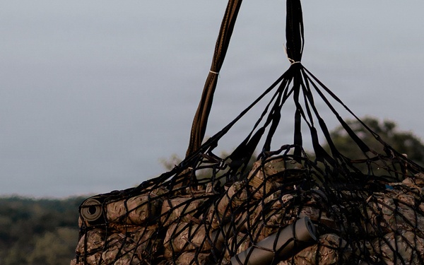 Illinois Army National Guard Black Hawk Crew Conducts Sling Load Resupply at Camp Grayling