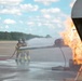 Navy Reserve Commander, Navy Installations Command Fire and Emergency Services Detachment Charlie train using the Mobile Aircraft Fire Trainer Device here at Naval Air Station Jacksonville.