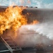 Navy Reserve Commander, Navy Installations Command Fire and Emergency Services Detachment Charlie train using the Mobile Aircraft Fire Trainer Device here at Naval Air Station Jacksonville.