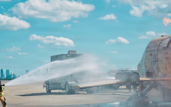 Navy Reserve Commander, Navy Installations Command Fire and Emergency Services Detachment Charlie train using the Mobile Aircraft Fire Trainer Device here at Naval Air Station Jacksonville.