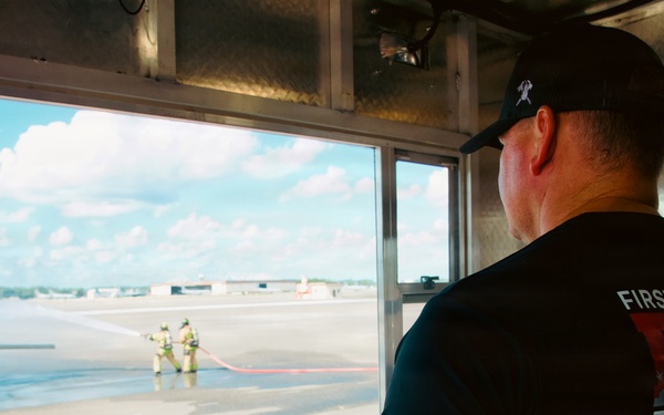 Navy Reserve Commander, Navy Installations Command Fire and Emergency Services Detachment Charlie train using the Mobile Aircraft Fire Trainer Device here at Naval Air Station Jacksonville.