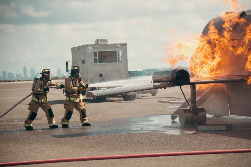 Firefighters from the 125th Fighter Wing of the Florida Air National Guard train using the Mobile Aircraft Fire Trainer Device here at Naval Air Station Jacksonville