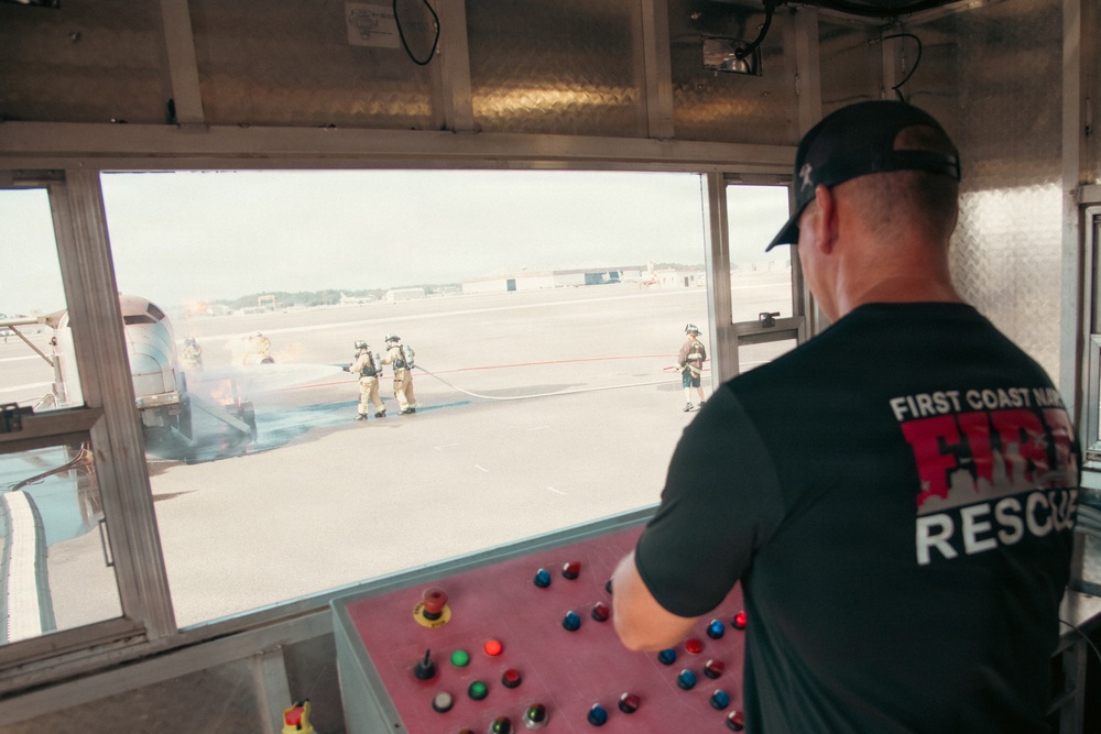 Firefighters from the 125th Fighter Wing of the Florida Air National Guard train using the Mobile Aircraft Fire Trainer Device here at Naval Air Station Jacksonville