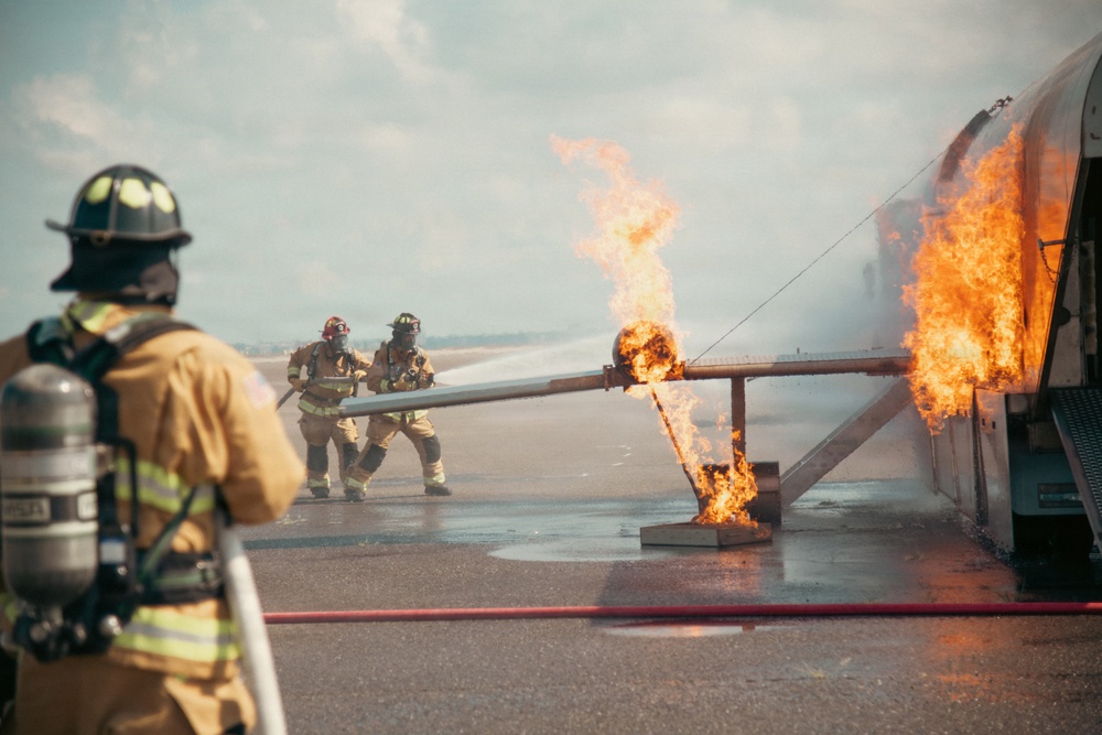 Firefighters from the 125th Fighter Wing of the Florida Air National Guard train using the Mobile Aircraft Fire Trainer Device here at Naval Air Station Jacksonville