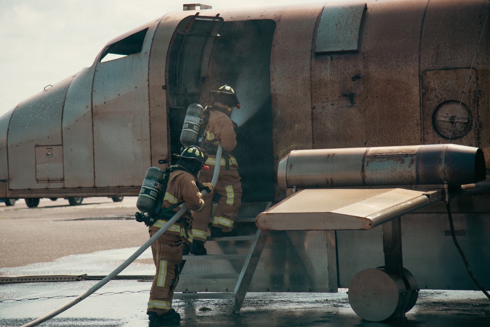 Firefighters from the 125th Fighter Wing of the Florida Air National Guard train using the Mobile Aircraft Fire Trainer Device here at Naval Air Station Jacksonville
