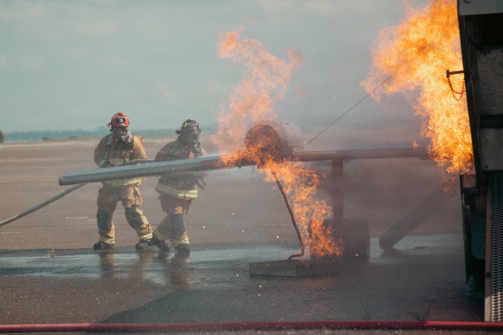 Firefighters from the 125th Fighter Wing of the Florida Air National Guard train using the Mobile Aircraft Fire Trainer Device here at Naval Air Station Jacksonville