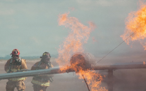 Firefighters from the 125th Fighter Wing of the Florida Air National Guard train using the Mobile Aircraft Fire Trainer Device here at Naval Air Station Jacksonville