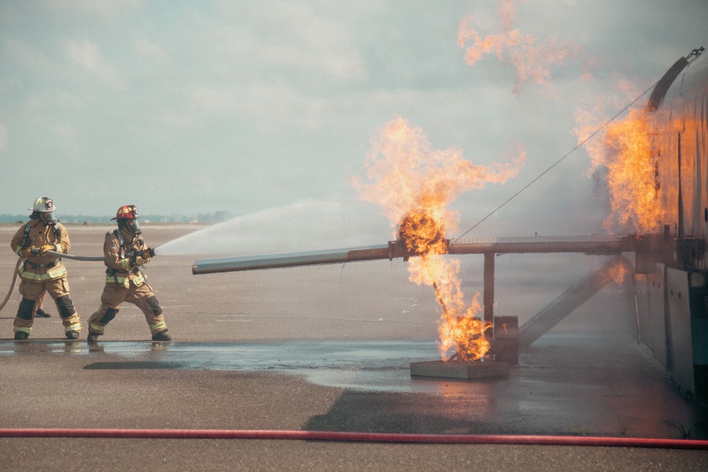 Firefighters from the 125th Fighter Wing of the Florida Air National Guard train using the Mobile Aircraft Fire Trainer Device here at Naval Air Station Jacksonville
