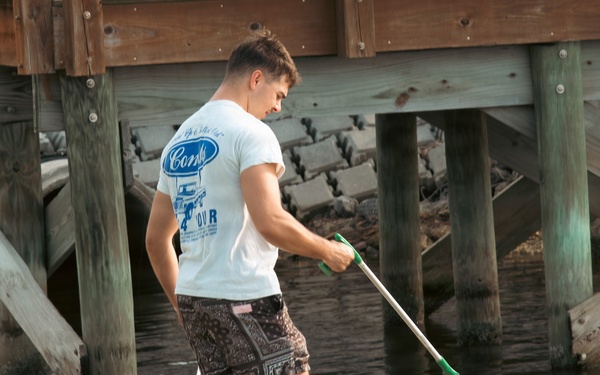 Sailors, retirees, and civilians from around the base volunteered to remove trash and other debris along the St. Johns River shoreline