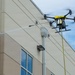 Demonstration of an Apellix B2 pressure washing drone to Naval Air Station Jacksonville leadership