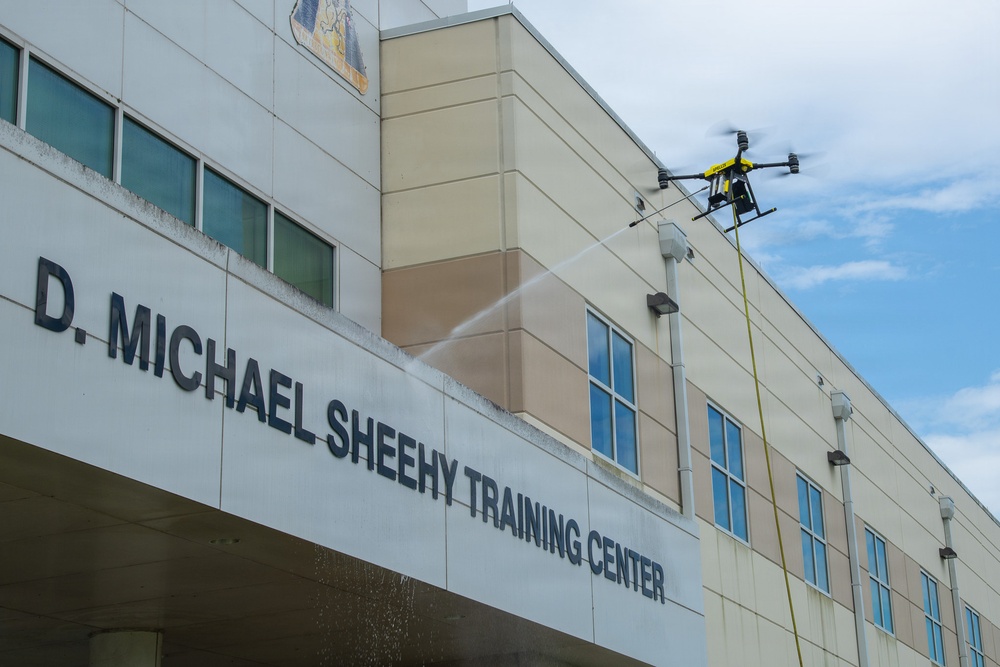 Demonstration of an Apellix B2 pressure washing drone to Naval Air Station Jacksonville leadership