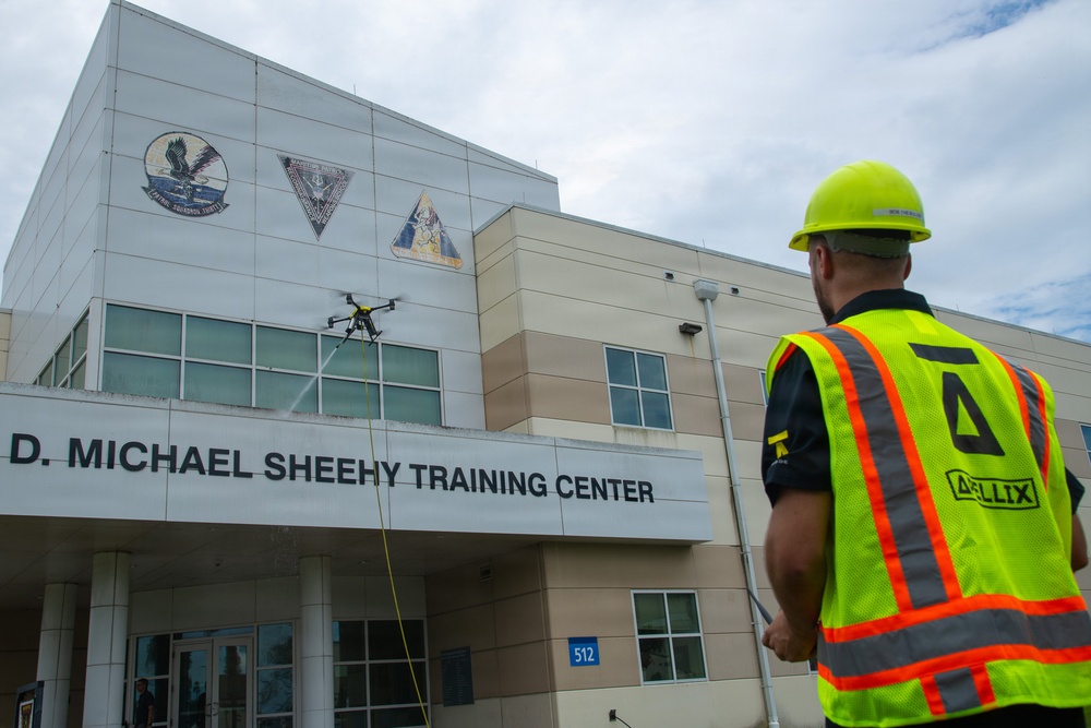 Demonstration of an Apellix B2 pressure washing drone to Naval Air Station Jacksonville leadership