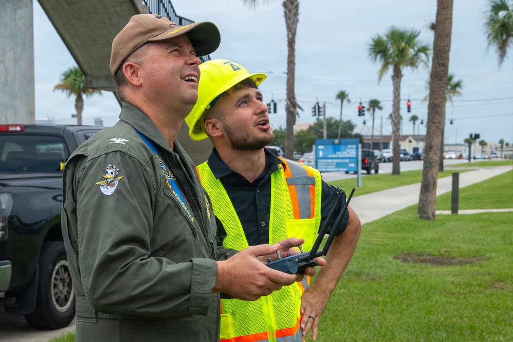 Demonstration of an Apellix B2 pressure washing drone to Naval Air Station Jacksonville leadership