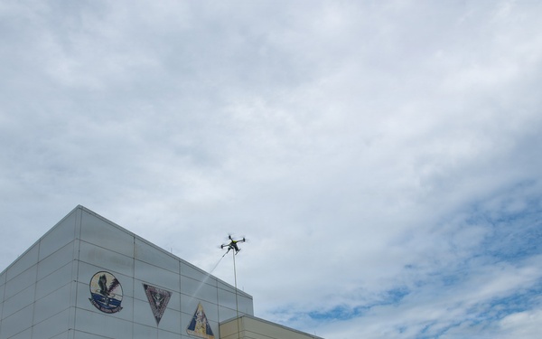 Demonstration of an Apellix B2 pressure washing drone to Naval Air Station Jacksonville leadership
