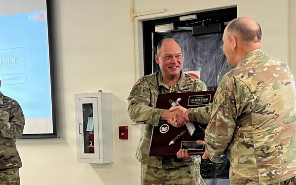 Lt. Col. Ryan Gore Receives Coveted Blackhawks Double Tomahawks Plaque.
