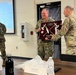 Lt. Col. Ryan Gore Receives Coveted Blackhawks Double Tomahawks Plaque.