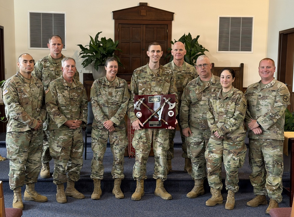 Logistics Officer Receives Blackhawks Double Tomahawks Plaque