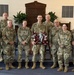 Logistics Officer Receives Blackhawks Double Tomahawks Plaque