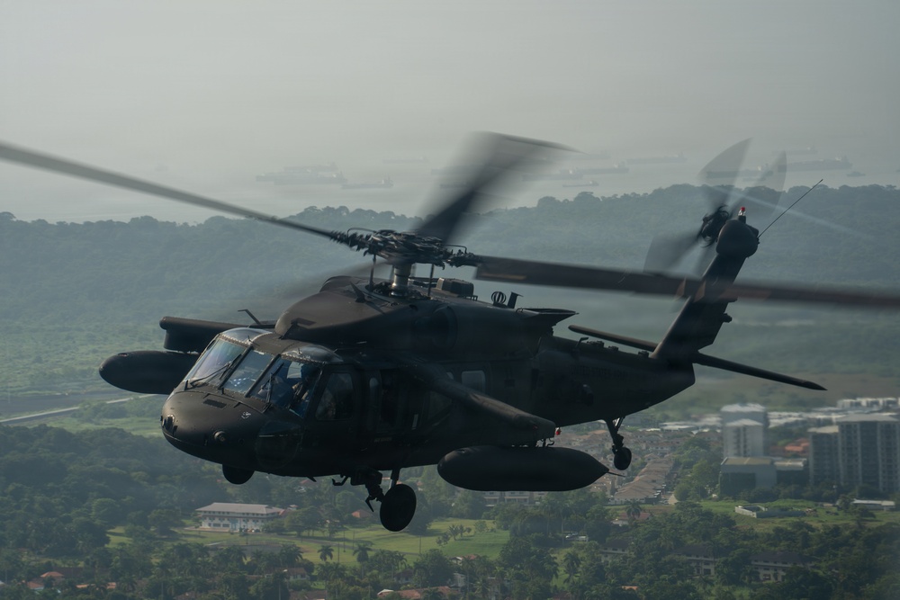Joint Task Force-Bravo’s 1st Battalion, 228th Aviation Regiment conducts a tactical flyover during PANAMAX 2026’s distinguished visitors day