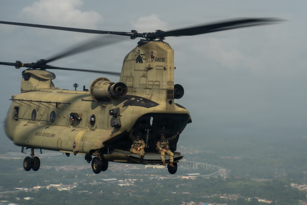 Joint Task Force-Bravo’s 1st Battalion, 228th Aviation Regiment conducts a tactical flyover during PANAMAX 2026’s distinguished visitors day