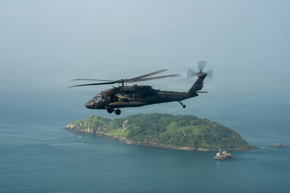 Joint Task Force-Bravo’s 1st Battalion, 228th Aviation Regiment conducts a tactical flyover during PANAMAX 2026’s distinguished visitors day
