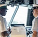 LCS 23 Command Senior Chief speaks wth RBDF midshipman in the ships pilot house.