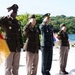 Allied Soldiers salute the fallen at Hill 303