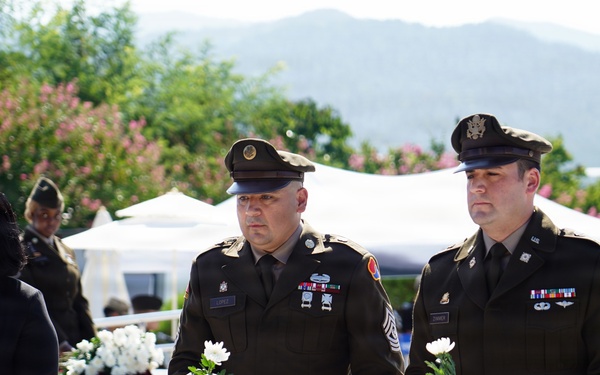 Flower-laying honors the fallen of Hill 303