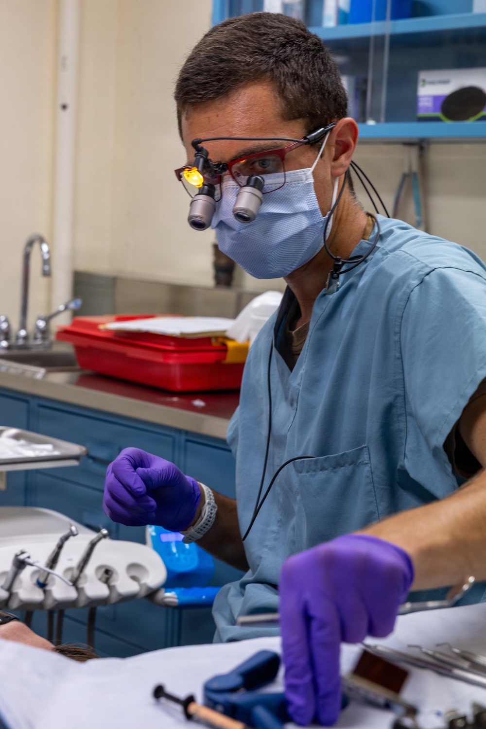 Dentist performs filling aboard PCU John F. Kennedy