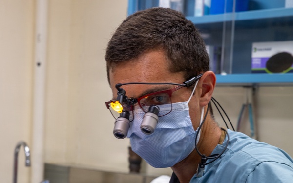 Dentist performs filling aboard PCU John F. Kennedy